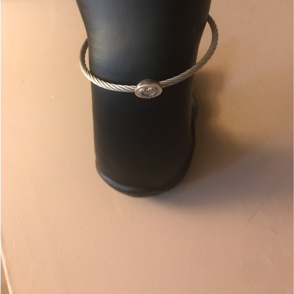 Genovese Jewelers sterling silver cable bangle with oval open heart diamond.
